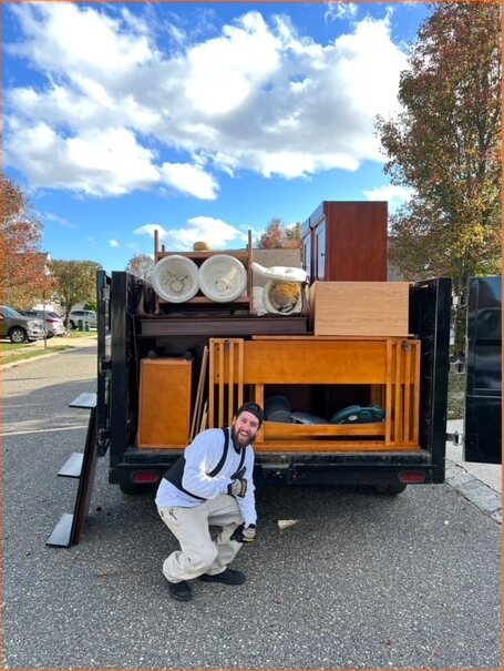 The ExtraHands ASAP crew carrying a wall unit out to the trailer